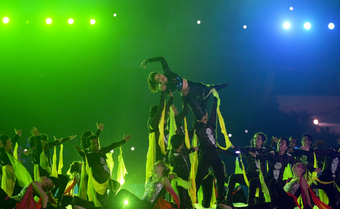 Priyanka Chopra performs with dancers during the inauguration of the Indian Super League football tournament 