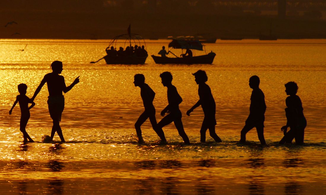 Devotees take a holy dip at the Sangam 