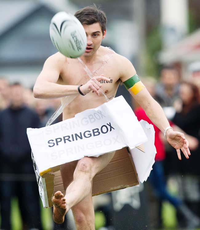 A player from New Zealand Nude Blacks runs with the ball 
