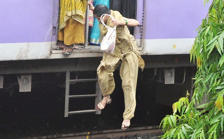 women jump of train