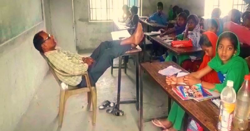 bihar-teacher-keeps-legs-on-desk-dozes-off-during-class-while-students