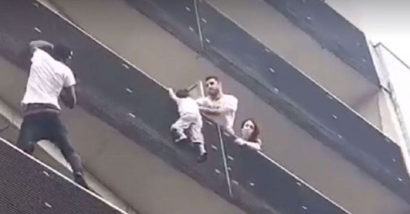 Image result for See this real time Spiderman scaling a building to rescue a kid